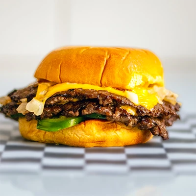 Smash burgers in Manchester from Crunchy Bite Fallowfield with loaded toppings and melted cheese